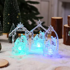 Macro view of transparent LED nativity scene ornaments with colorful glowing lights
