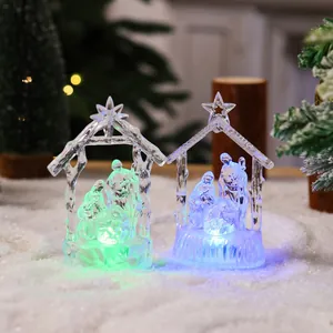 Crystal nativity scene set with colorful LED night lights on snowy background