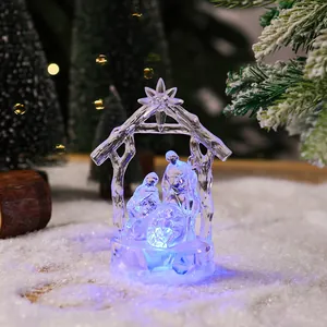 Detail view of crystal nativity scene night light with glowing blue LED illumination
