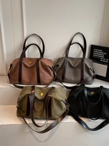 Vintage large capacity canvas travel bags shown in brown, grey, olive and black colors