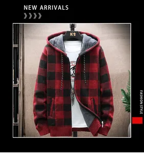 Close-up view of a red and black buffalo plaid knitted cardigan with hood and zipper