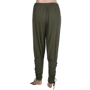Rear view of green medieval renaissance men's trousers with lace-up cuffed ankles.