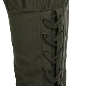 Close-up detail of lace-up cuffs on medieval Renaissance cotton linen pants