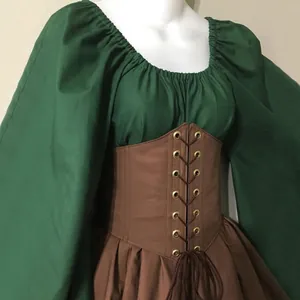 Close-up of a green and brown Renaissance medieval Halloween dress on a mannequin.