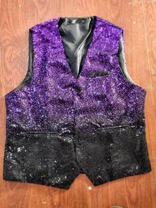 Detailed macro view of men's purple to black gradient sequin waistcoat for stage party