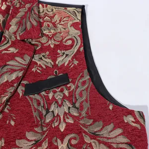 Close-up of red jacquard men's vest with damask floral pattern and black leather trim