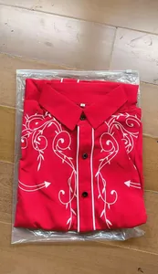 Men's Western style red embroidered shirt featuring white floral patterns and piping.