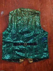 Detailed view of the gradient green and gold sequins on the back of the vest