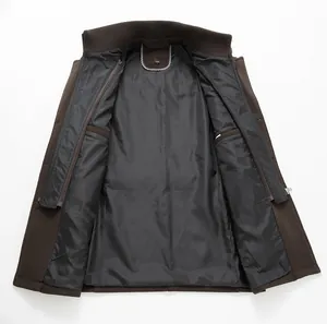 Detailed interior view of a brown men's wool coat showing black lining and inner pockets