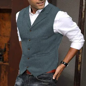 Close-up detail of a men's slim fit wool herringbone business waistcoat in grey blue