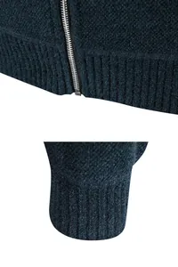 Close-up macro detail of dark blue men's knit cardigan texture and premium metal zipper