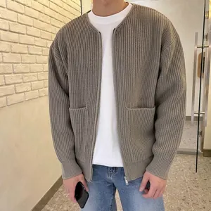 Detailed view of a men's loose ribbed knit cardigan with a front zipper in taupe grey color