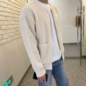 Detailed close-up of a men's stylish oversized chunky knit cardigan in cream white