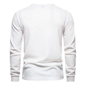 Back view of a white waffle knit long sleeve Henley T-shirt with textured fabric