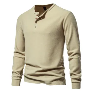 Detail view of men's waffle knit Henley shirt showing fabric texture and buttons