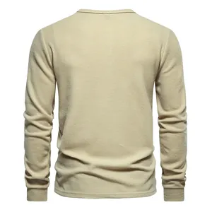 Detailed back view of a men's long-sleeve waffle knit Henley shirt in beige khaki
