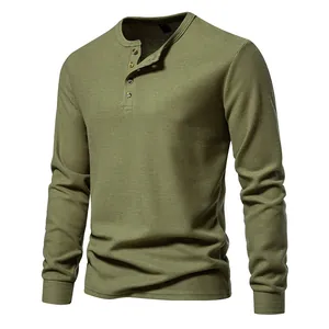Detail view of men's olive green waffle knit Henley shirt with four-button placket