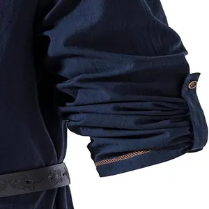 Detail of blue men's casual long sleeve shirt with rolled-up button tab sleeves