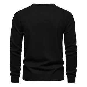 Back view macro detail of men's black waffle knit long sleeve henley T-shirt top