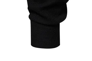 Close-up of the ribbed cuff and waffle knit texture on a black men's long sleeve Henley T-shirt.