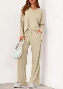 Macro view of textured ribbed two-piece set featuring V-neck top and wide-leg trousers