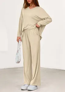 Full-body view of women's loose casual two-piece set with long sleeves and wide-leg pants