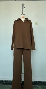 Detailed front view of a brown long-sleeved polo collar sweatshirt and wide-leg trousers set