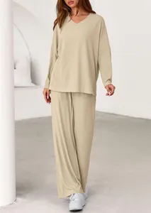 Full view of women's beige ribbed loungewear set with loose V-neck top and pants