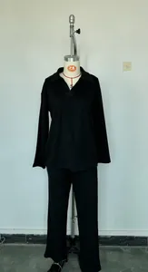 Two-piece black loungewear set with a long-sleeve Polo collar pullover and wide-leg pants