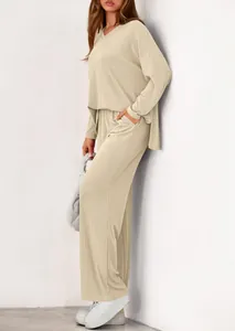 Casual beige ribbed two-piece set featuring long-sleeve V-neck top and wide-leg pants