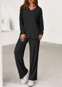 Detailed look at the black ribbed two-piece set featuring loose top and wide pants.