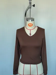 Detailed view of a slim-fit brown V-neck long sleeve T-shirt displayed on a mannequin form
