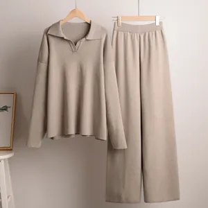 Elegant beige knit two-piece set featuring a Polo neck sweater and wide-leg trousers