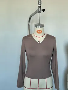 Detailed front view of a slim fit brown V-neck long sleeve milk silk base shirt