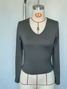 Detailed view of women's dark grey V-neck long sleeve slim fit milk silk base layer top.