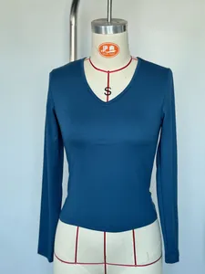 Front view of a peacock blue women's slim-fit V-neck long-sleeve T-shirt on a mannequin