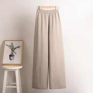 Cozy beige wide-leg knitted trousers with elastic high waist for autumn and winter.