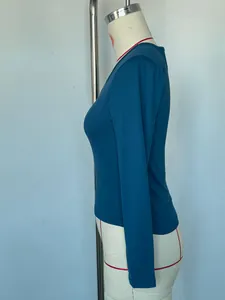 Side view of a slim fit blue V-neck long sleeve T-shirt on a professional mannequin.