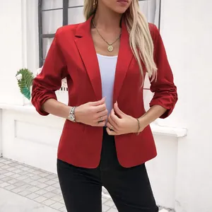 Elegant red blazer for women with notched lapel and ruched sleeves, business casual style.
