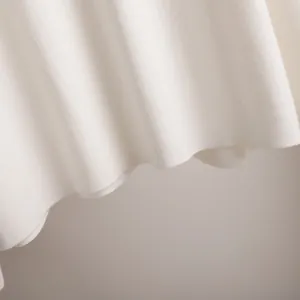 Close-up of premium white knitted fabric texture for women's two-piece lounge set