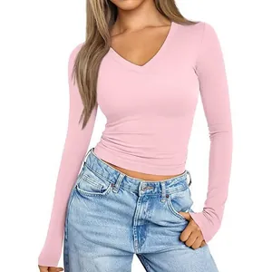 Slim fit women's V-neck long sleeve T-shirt in baby pink color, soft fabric.