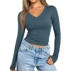 Detailed view of a slim fit women's long sleeve V-neck t-shirt in teal blue color