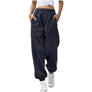 Close-up of comfortable high-waisted loose sweatpants with pockets in charcoal gray color