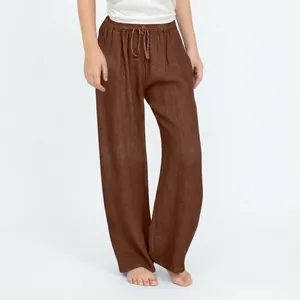 Close-up detail of kids brown cotton linen wide-leg trousers with drawstring waistband