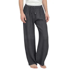 Macro view of girls' dark grey cotton linen wide leg trousers featuring drawstring waist