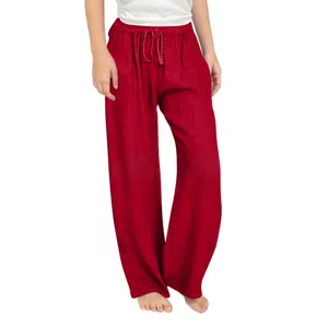 Detail of red girls' linen wide-leg pants featuring a comfortable drawstring waist design