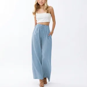 Casual girls light blue wide leg linen trousers featuring a drawstring waist and side pockets
