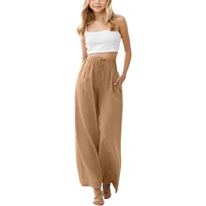 Detailed view of girls brown linen wide-leg trousers with drawstring and pockets
