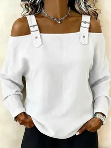 Front detailed shot of a stylish white off-the-shoulder top with buckle straps