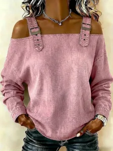 Detailed view of pink cold shoulder top featuring adjustable metal buckle straps.